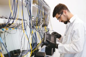 Network technician testing modems